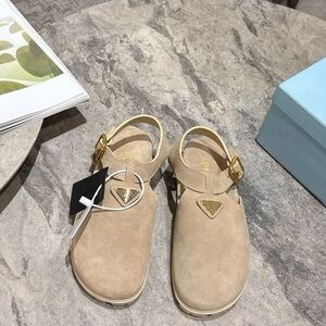 Prada Tan Suede Clogs with Gold Accents